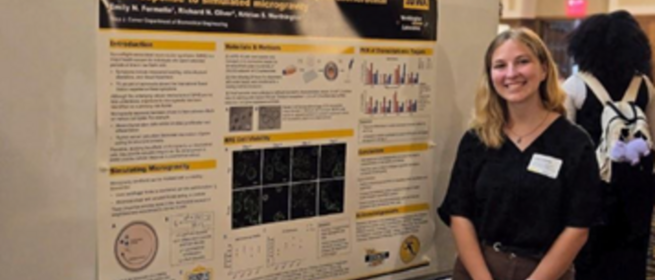 Emily Formella poses with her research poster